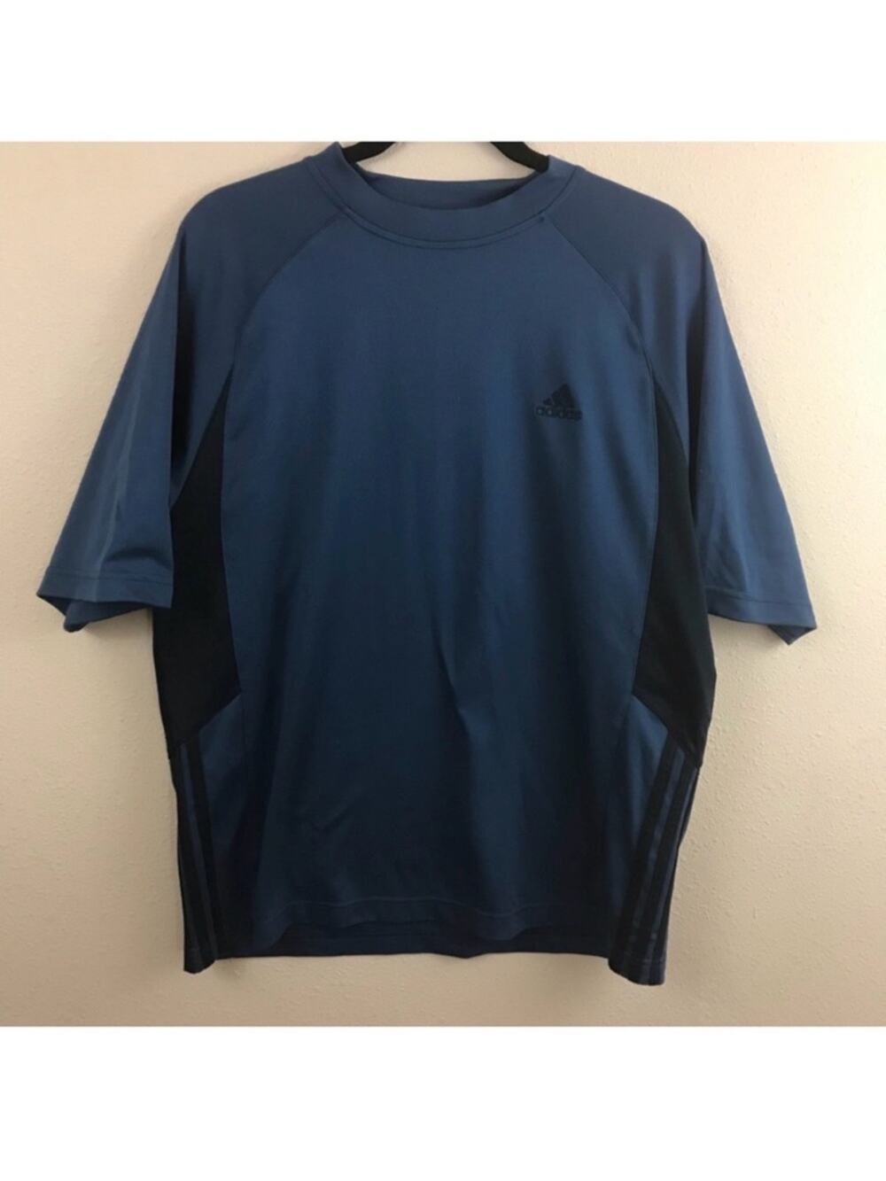 Adidas shirt. No size tag, but measures similar to a Large. Good used condition!